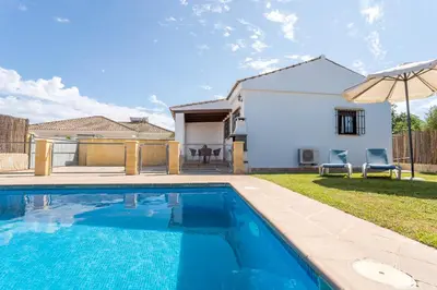 a swimming pool in the backyard of a house at EntreCalas 2 Chalet con piscina privada en Conil, Roche viejo, cala del aceite in Conil de la Frontera