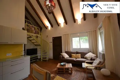 a living room with a couch and a table at Villa Aurora in Cádiz