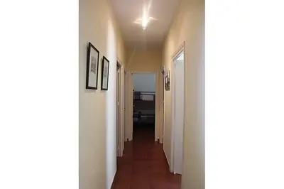 a hallway with a hallway leading to a room at La Morena 68 in Chiclana de la Frontera