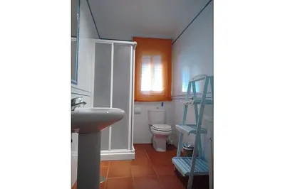 a bathroom with a sink and a toilet at La Morena 68 in Chiclana de la Frontera