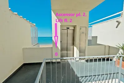 a stairway leading to the beach from a building at On Beach Deluxe Apartment with Pools and own Garden in El Puerto de Santa María