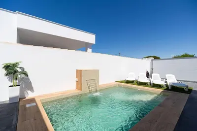 a swimming pool in the backyard of a house at Bisonte A in Chiclana de la Frontera