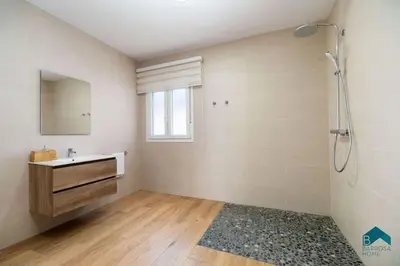 a bathroom with a shower and a sink and a mirror at Bisonte A in Chiclana de la Frontera