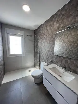 a bathroom with a toilet and a sink at GRANIZO A in Chiclana de la Frontera