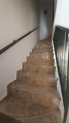 a stairway with wooden steps in a building at Casa Carmen in Sanlúcar de Barrameda