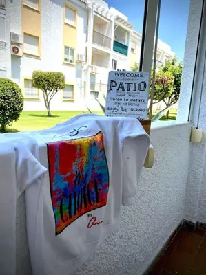 a pair of shirts are on a window sill at MyChoice Alegria in Rota