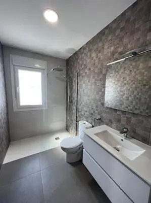 a bathroom with a toilet and a sink at GRANIZO B in Chiclana de la Frontera