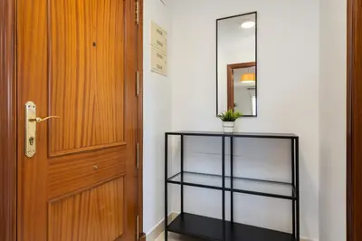 a door and a glass shelf next to a door at Apartoyou - Soto de Vistahermosa in El Puerto de Santa María