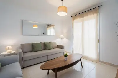 a living room with a couch and a table at Apartoyou - Soto de Vistahermosa in El Puerto de Santa María