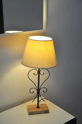 a lamp sitting on a table in a room at Apartamento Jilguero con parking individual privado in Sanlúcar de Barrameda