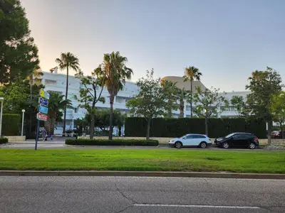 two cars parked in front of a building at costa ballena elite in Costa Ballena