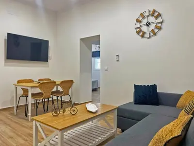 a living room with a couch and a table at Apartamento J Burgos - Ole Solutions in El Puerto de Santa María