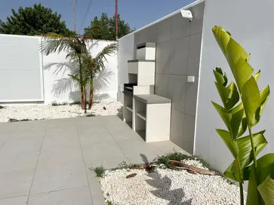 a house with a staircase on the side of it at Chalet El Eden in Chiclana de la Frontera