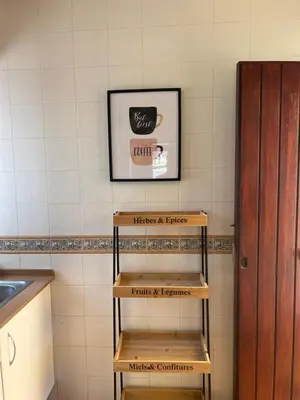 a set of wooden shelves in a kitchen at Chalet Urb Doña Violeta 500m Mar in Chiclana de la Frontera