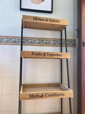a set of three wooden shelves in a bathroom at Chalet Urb Doña Violeta 500m Mar in Chiclana de la Frontera