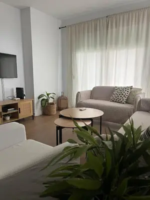 a living room with a couch and a table at Apartamento Vista Bahia - Vistahermosa in El Puerto de Santa María