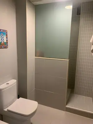 a bathroom with a toilet and a shower at Apartamento Vista Bahia - Vistahermosa in El Puerto de Santa María
