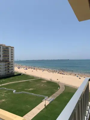 a view of the beach from the balcony of a condo at Apartamento Vista Bahia - Vistahermosa in El Puerto de Santa María