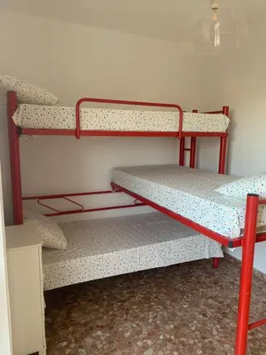 a room with two bunk beds in a room at Apartamento Vista Bahia - Vistahermosa in El Puerto de Santa María