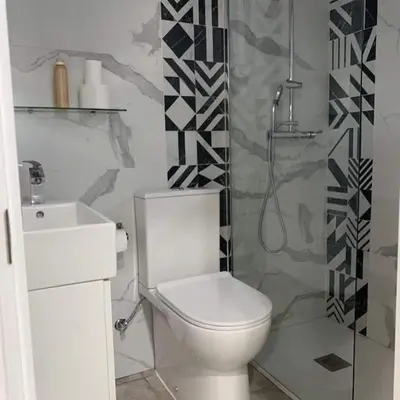 a bathroom with a toilet and a shower at LOS ANTONIOS Loft Rural Chipiona in Cádiz