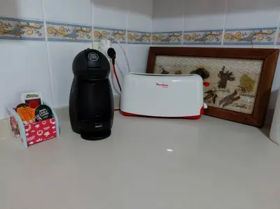 a kitchen counter with a blender and a toaster at Apartamento La Porteña, 200 ms de playa Victoria in Cádiz