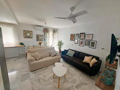 a living room with a couch and a table at Barrameda 19 in Sanlúcar de Barrameda
