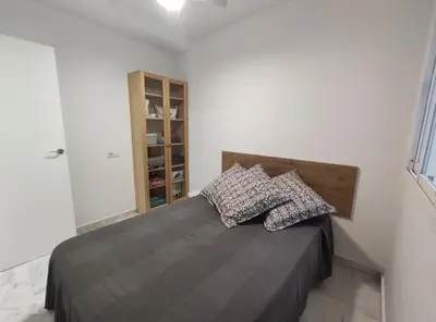 a bedroom with a bed with two pillows on it at Barrameda 19 in Sanlúcar de Barrameda