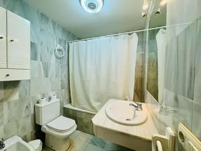 a bathroom with a sink and a toilet and a shower at Hoyo 27 con Piscina Grupo AC Gestión in Chiclana de la Frontera