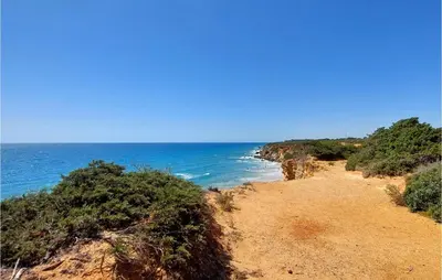 a view of the ocean from a sandy beach at Lovely Apartment In Chiclana De La Front in Poblado de Sancti Petri