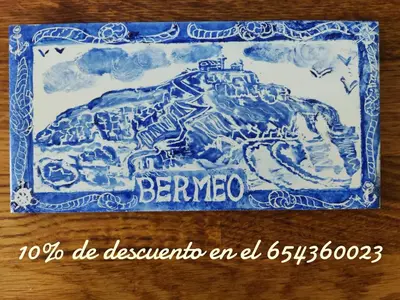 a blue and white cake with a mountain on it at Casa Bermeo in Sanlúcar de Barrameda