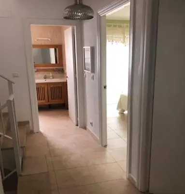 a room with a kitchen and a hallway with a hallwayngthngthngthngthngth at VILLA MARISMAS DE LA ALMADRABA in Chiclana de la Frontera