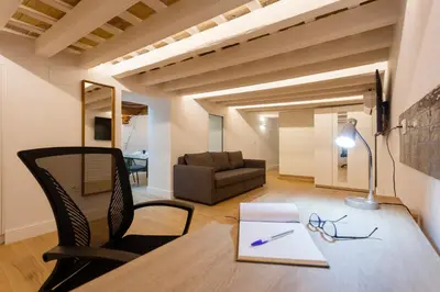 a living room with a table and a couch at Estudio Amor BRUJO by Cadiz4Rentals in Cádiz