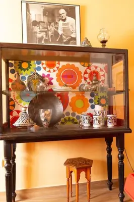 a glass shelf with vases and other items on it at Columela by Gades Gestión in Cádiz