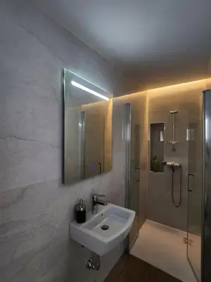 a white bathroom with a sink and a shower at Apartamento Ancha 3 in Sanlúcar de Barrameda