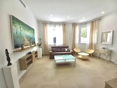 a living room with a couch and a table at Dani Home in Cádiz