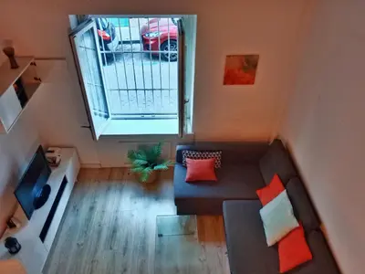 an overhead view of a living room with a couch and a window at Apartamento Buhardilla Cruz Vieja in Jerez de la Frontera