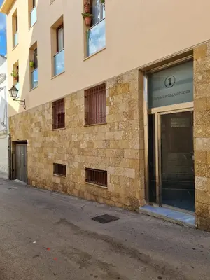 a brick building with a sign on the side of it at Mar de la Viña - Free Parking by Cádiz Time in Cádiz