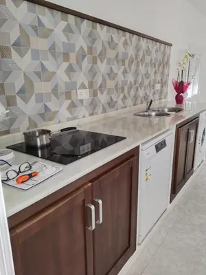 a kitchen with a sink and a counter top at Casa EDU in Sanlúcar de Barrameda