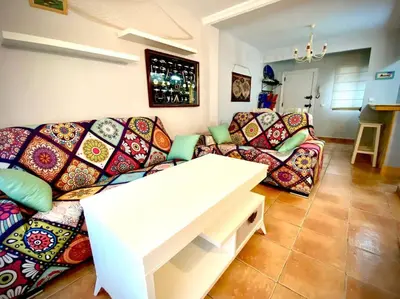 a living room with a couch and a table at MyChoice Marina in Rota