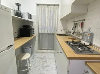 a kitchen with a stove and a counter top at Cozy Apartment in Chiclana City Center by Chiclana Dreams in Chiclana de la Frontera