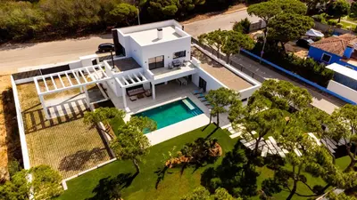 an aerial view of a white house with a swimming pool at ALBA SEA VILLA in Chiclana de la Frontera