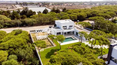 an aerial view of a house with a pool and trees at ALBA SEA VILLA in Chiclana de la Frontera