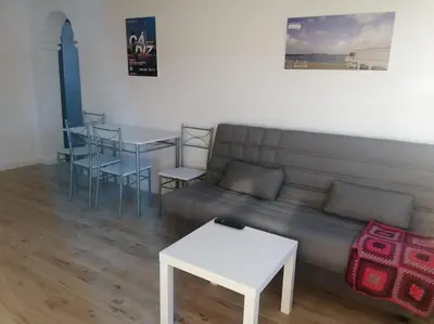 a living room with a couch and a table at Apartamento/Flat San Fernando Cádiz in San Fernando