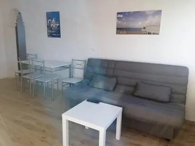 a living room with a couch and a table at Apartamento/Flat San Fernando Cádiz in San Fernando