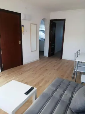 a living room with a couch and a table at Apartamento/Flat San Fernando Cádiz in San Fernando