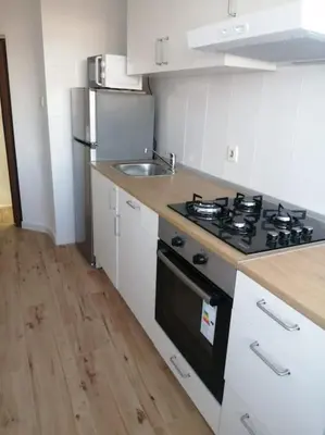 a kitchen with a stove and a sink at Apartamento/Flat San Fernando Cádiz in San Fernando