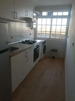 a kitchen with a sink and a stove top oven at Apartamento/Flat San Fernando Cádiz in San Fernando