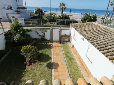 a view of the backyard of a house with the beach at Quinta La Solana in Chiclana de la Frontera