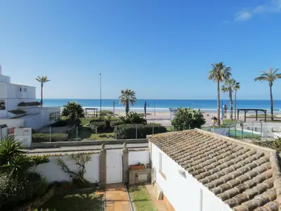 a view of the beach from a house at Quinta La Solana in Chiclana de la Frontera