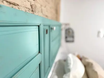 a blue cabinet with a window in a room at Apartamento Boutique Kala Ático in Jerez de la Frontera
